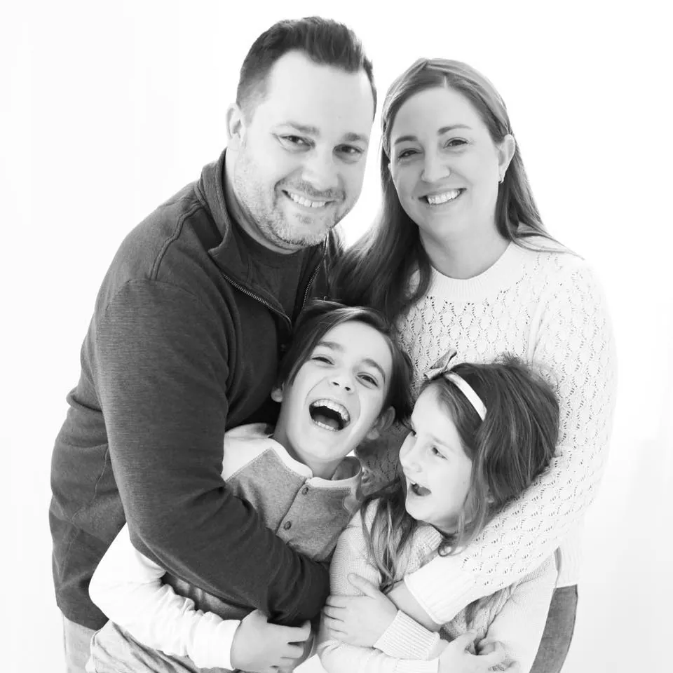 Will Mau with his wife and two children at home in Rotterdam, NY